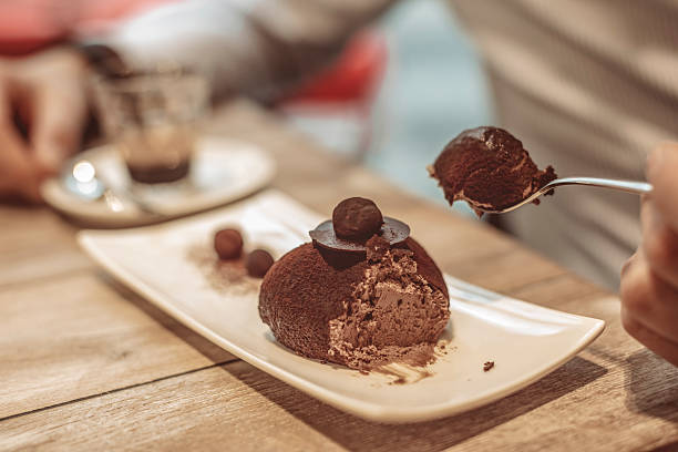 Young Man Eating Chocolate Cake